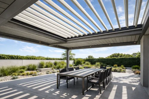 Modern aluminum pergola with adjustable louvers over outdoor dining area in Dubai garden