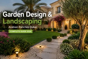 Garden design and landscaping in Arabian Ranches Dubai with villa lawn, pathway, outdoor lighting, palm trees, and flowering plants.